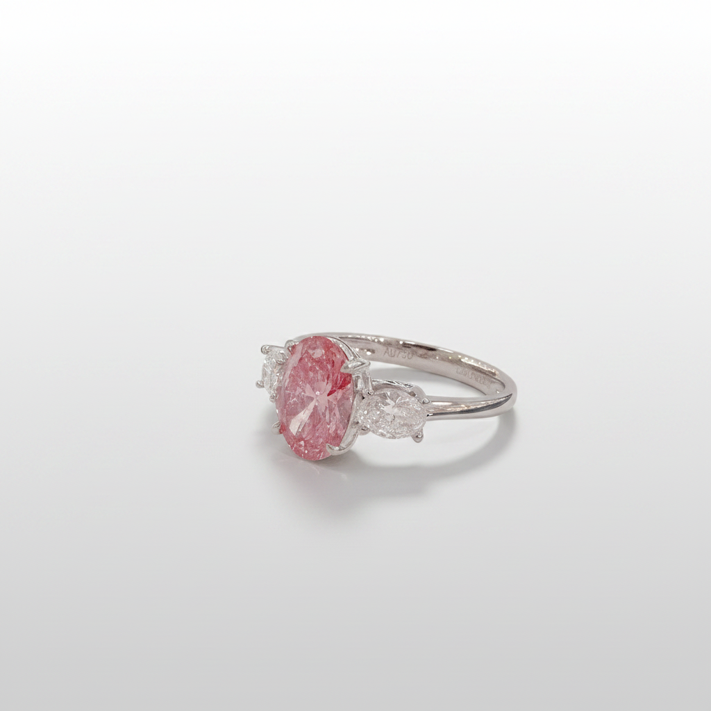 18K White Gold Lab-Grown Pink Diamond Oval Three-Stone Ring - 45 Degree View